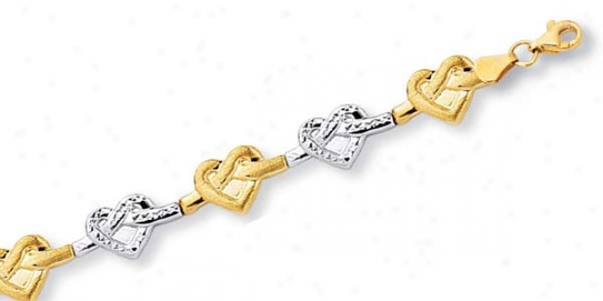 10k Two-tone Twisted Heart Link Bracelet - 7.25 Inch